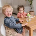 L0223-Perlimpinpin-Bib-with-Sleeves-Bavoir-Manches-Cayenne-Cayenne_photo_Lifestyle4_1100x.webp